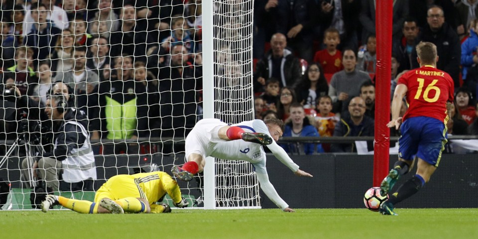 Jamie Vardy is sent tumbling by Pepe Reina to earn England their first half penalty