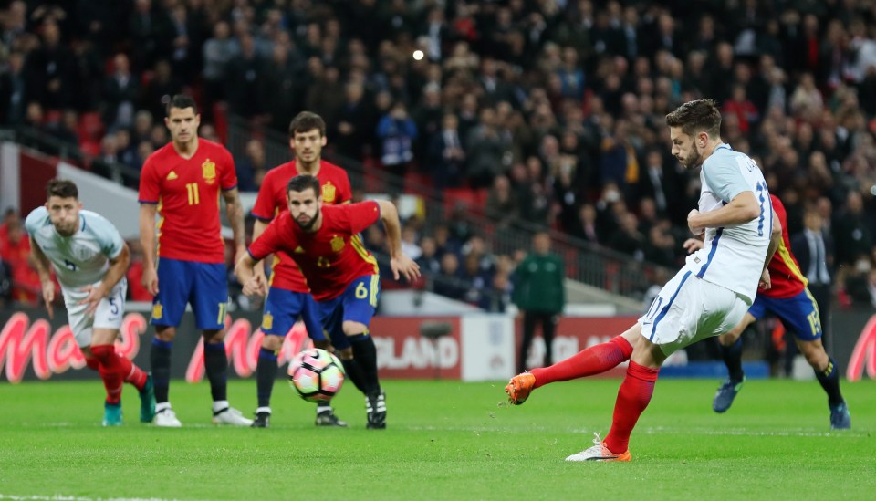 Adam Lallana keeps his cool to convert from the spot to give England the lead against Spain