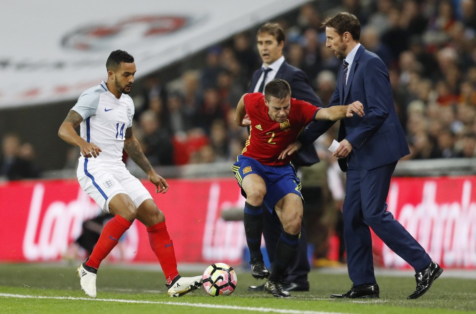 Cesar Azpilicueta is close to colliding with Gareth Southgate on the touchline
