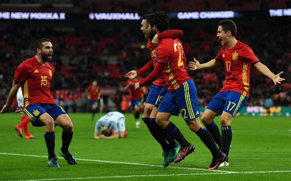 Isco is mobbed after his last gasp equaliser stunned England