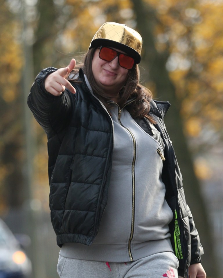 Honey G in her trademark hat and shades 