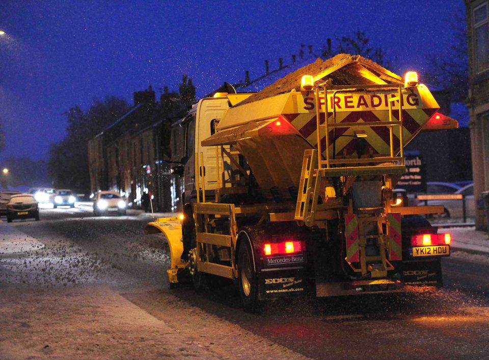 A gritting lorry was pictured attempting to make the commute easier for locals in Greater Manchester 