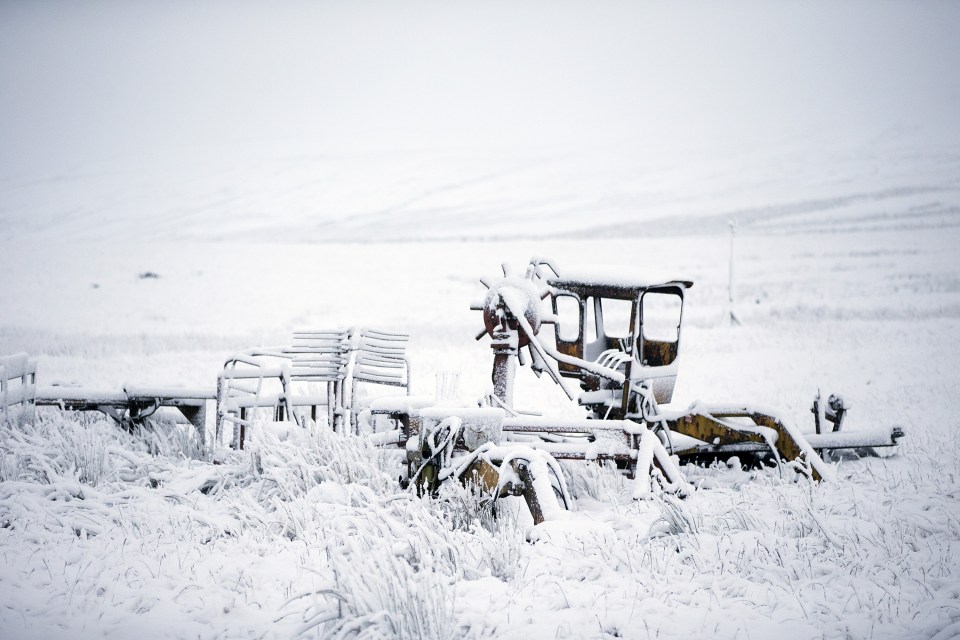Farm equipment was covered in snow having been left out overnight in a field in the Yorkshire Dales