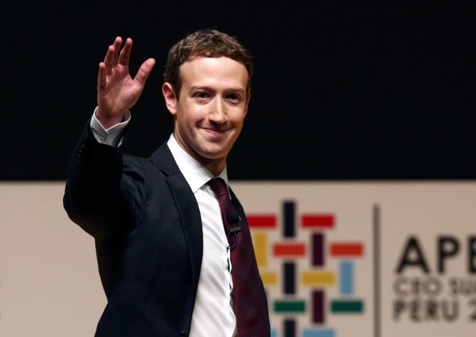 Facebook founder Mark Zuckerberg waves to the audience during a meeting of the APEC (Asia-Pacific Economic Cooperation) Ceo Summit in Lima