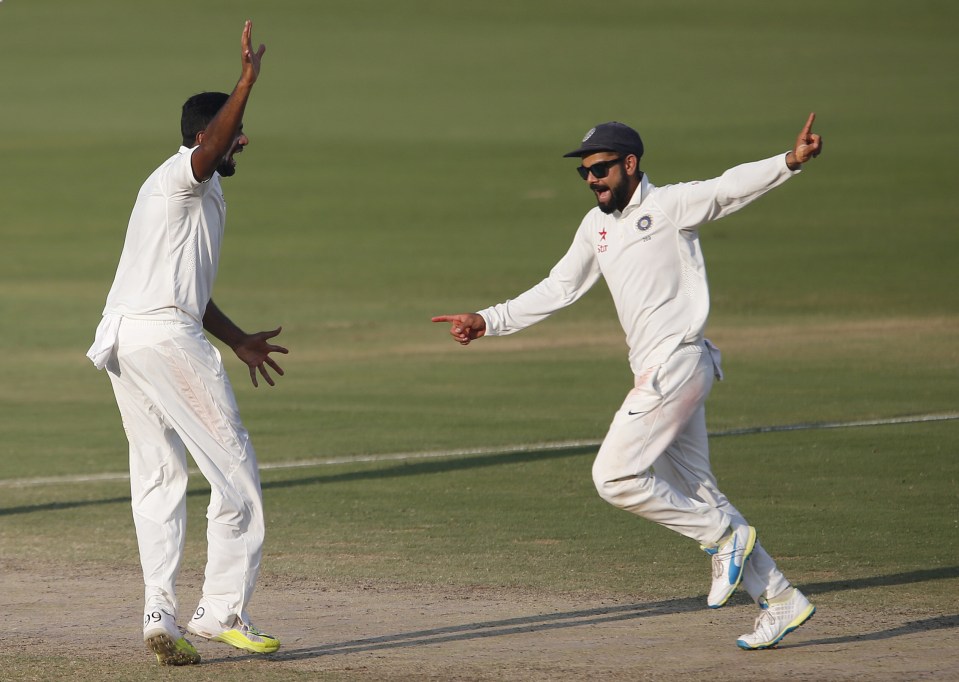 India's captain Virat Kohli, right, and Ravichandran Ashwin celebrate the dismissal of England's Haseeb Hameed