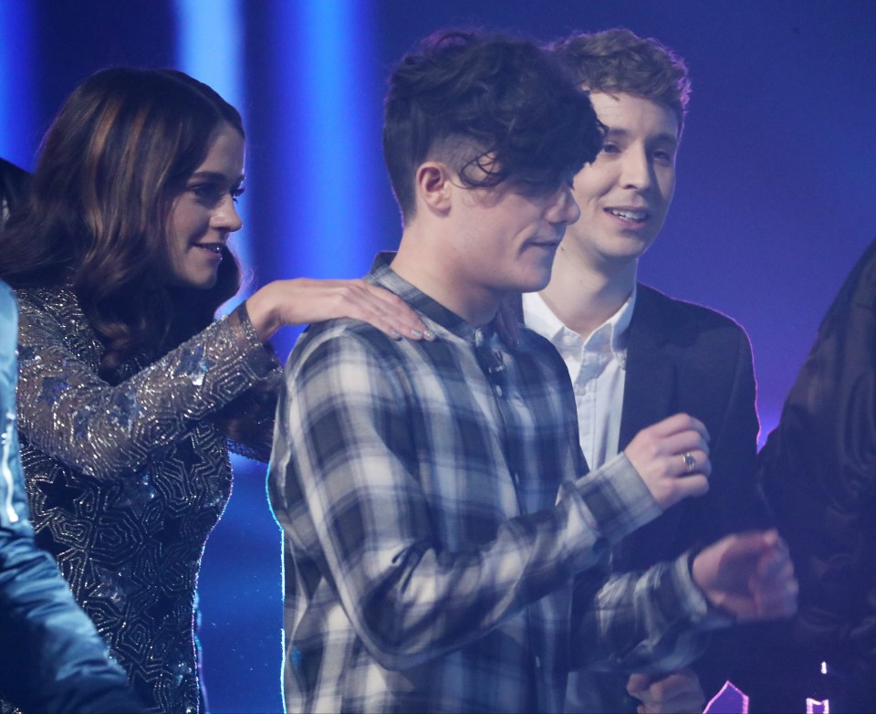 Emily could be seen giving Ryan a back rub 