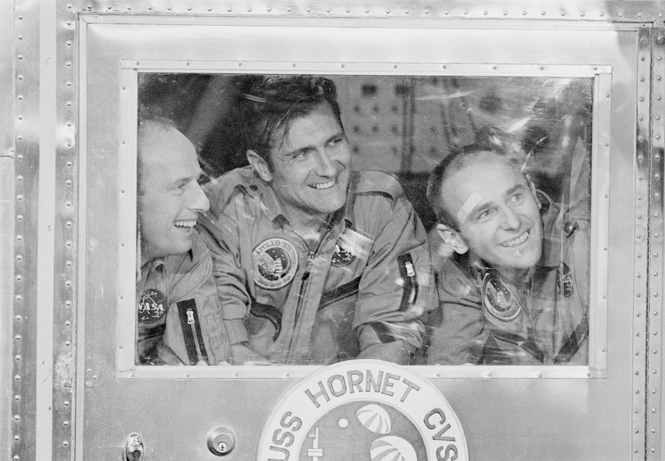 We know why youre grinning... The three astronauts pose for a picture