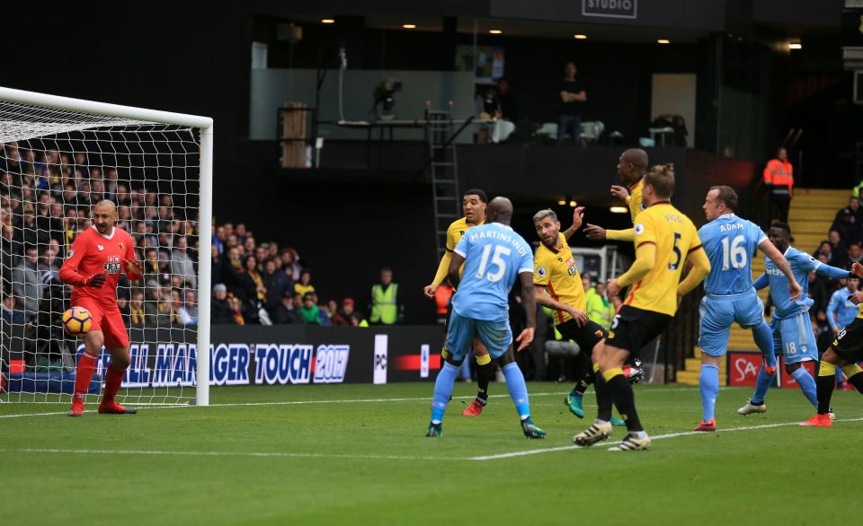 Gomes is caught static as the ball comes back off the post towards him