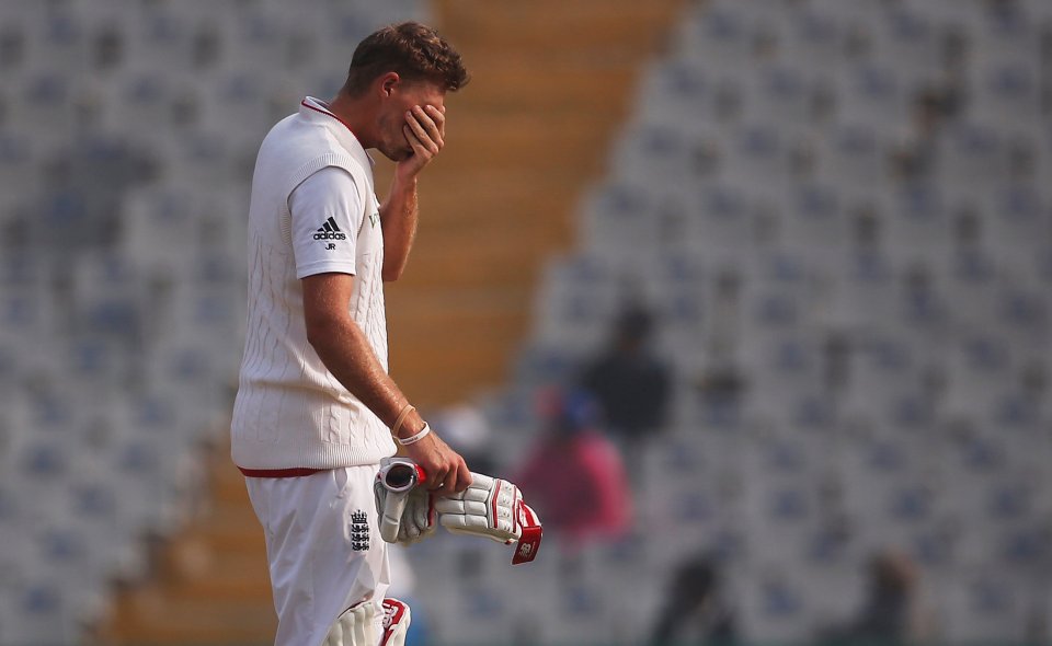 Joe Root holds his head in his hands after being given out