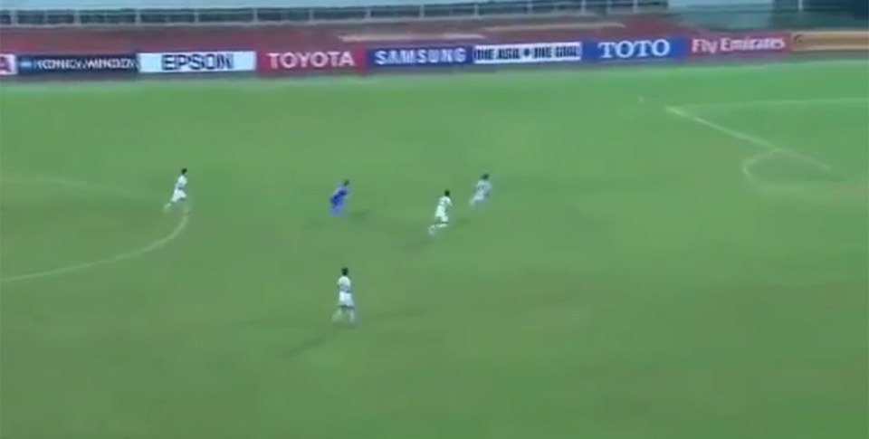 North Korean goalkeeper rushes out to far as the ball goes over his head 