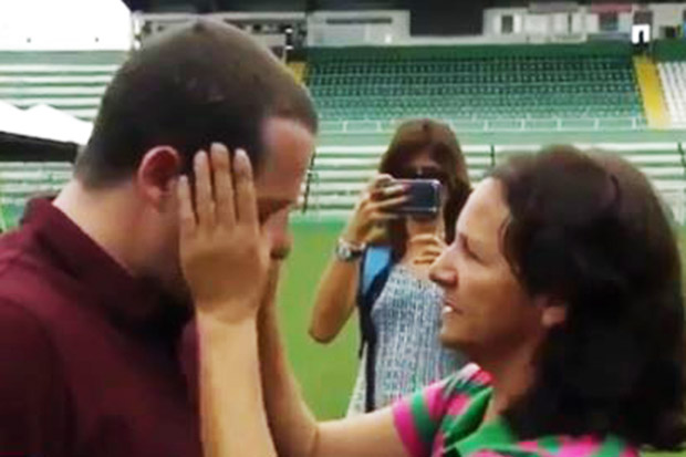 The mother of deceased keeper Danilo wipes away the journalist's tears