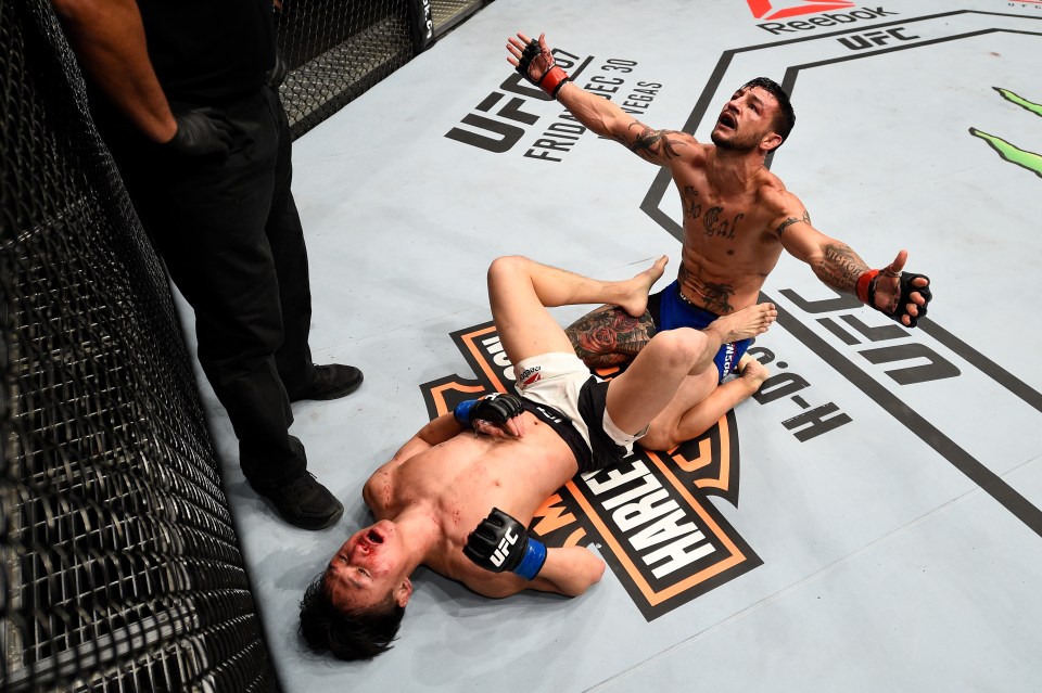 TORONTO, CANADA - DECEMBER 10: (R-L) Cub Swanson and Dooho Choi of South Korea react after the conclusion of their three-round featherweight bout during the UFC 206 event inside the Air Canada Centre on December 10, 2016 in Toronto, Ontario, Canada. (Photo by Jeff Bottari/Zuffa LLC/Zuffa LLC via Getty Images)