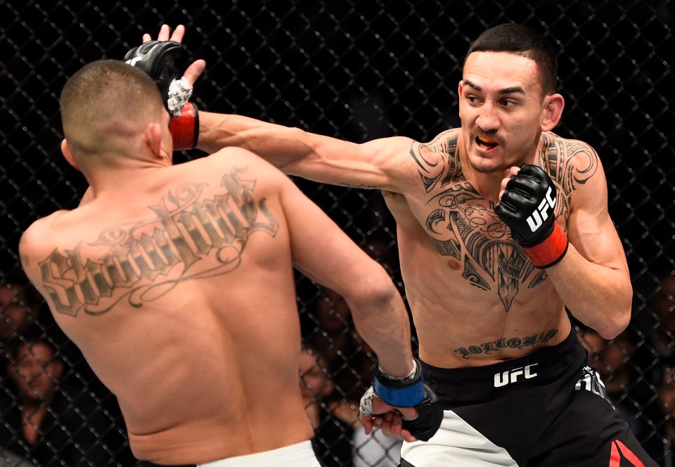 TORONTO, CANADA - DECEMBER 10: (R-L) Max Holloway punches Anthony Pettis in their interim UFC featherweight championship bout during the UFC 206 event inside the Air Canada Centre on December 10, 2016 in Toronto, Ontario, Canada. (Photo by Jeff Bottari/Zuffa LLC/Zuffa LLC via Getty Images)