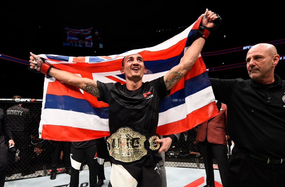 TORONTO, CANADA - DECEMBER 10: Max Holloway celebrates his TKO victory over Anthony Pettis in their interim UFC featherweight championship bout during the UFC 206 event inside the Air Canada Centre on December 10, 2016 in Toronto, Ontario, Canada. (Photo by Jeff Bottari/Zuffa LLC/Zuffa LLC via Getty Images)