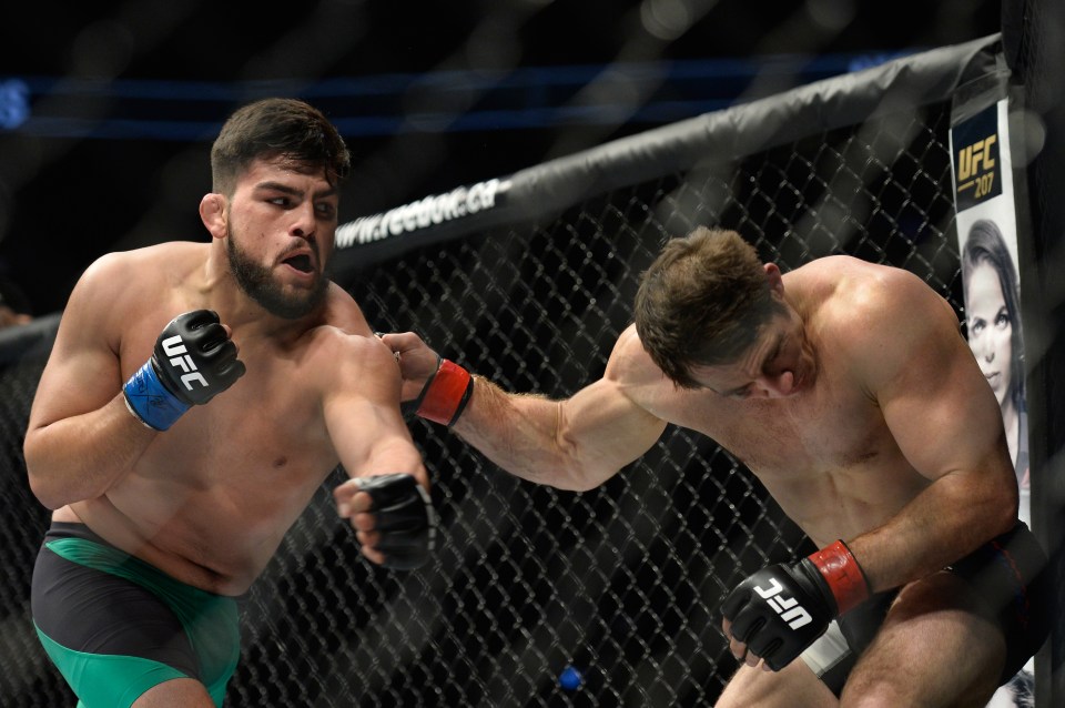 TORONTO, CANADA - DECEMBER 10: (L-R) Kelvin Gastelum punches Tim Kennedy in their middleweight bout during the UFC 206 event inside the Air Canada Centre on December 10, 2016 in Toronto, Ontario, Canada. (Photo by Brandon Magnus/Zuffa LLC/Zuffa LLC via Getty Images)