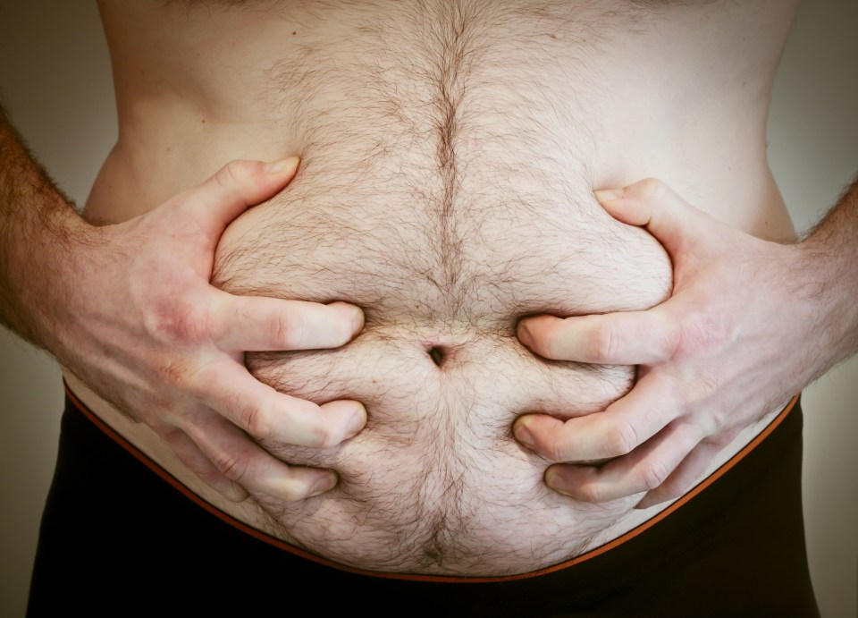 Fat man grabbing his flab