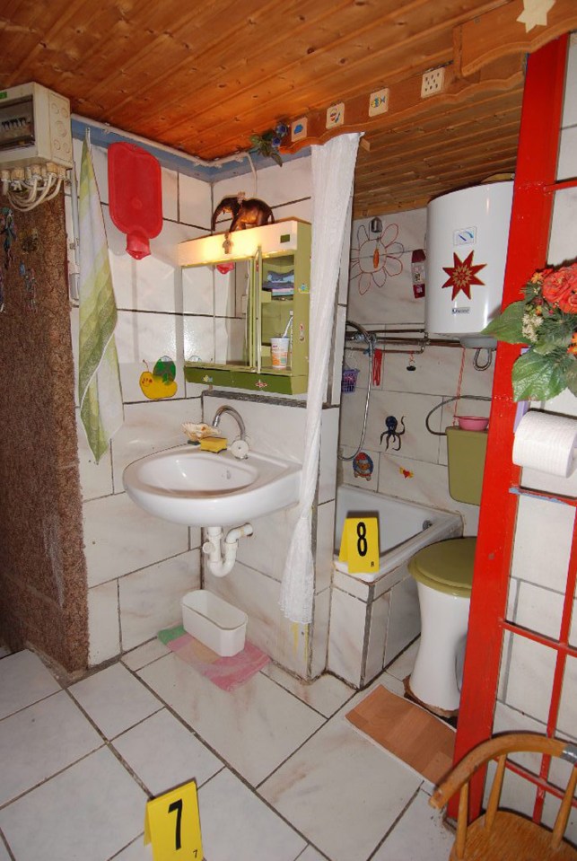 A photo taken by a police forensic team shows a bathroom in the house of horrors