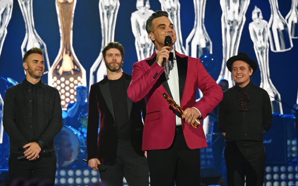 Robbie was joined on stage by his former Take That band mates