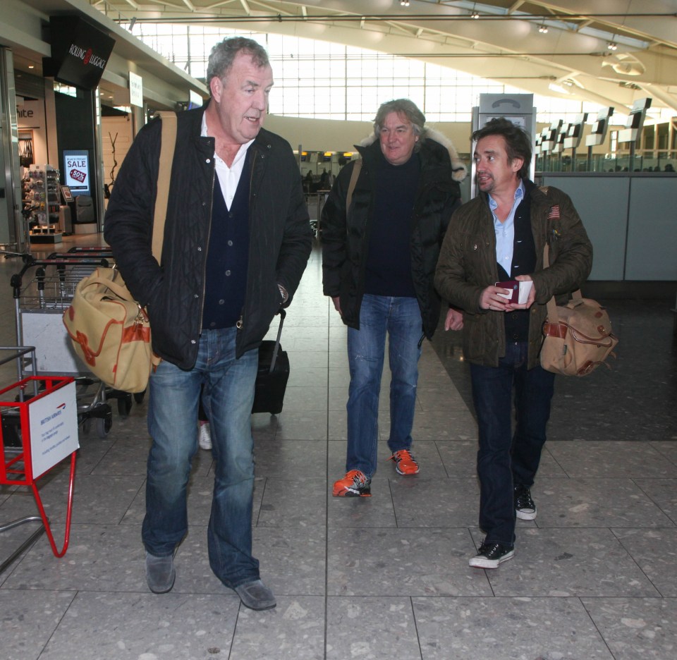 Jeremy Clarkson was deep in conversation with his Grand Tour co-stars Richard Hammond and James May as they arrived in Heathrow Airport