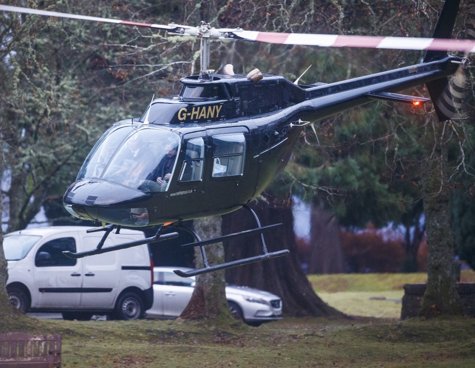 Up, up and away ... Hammond gets the rotors whirling as he begins journey home