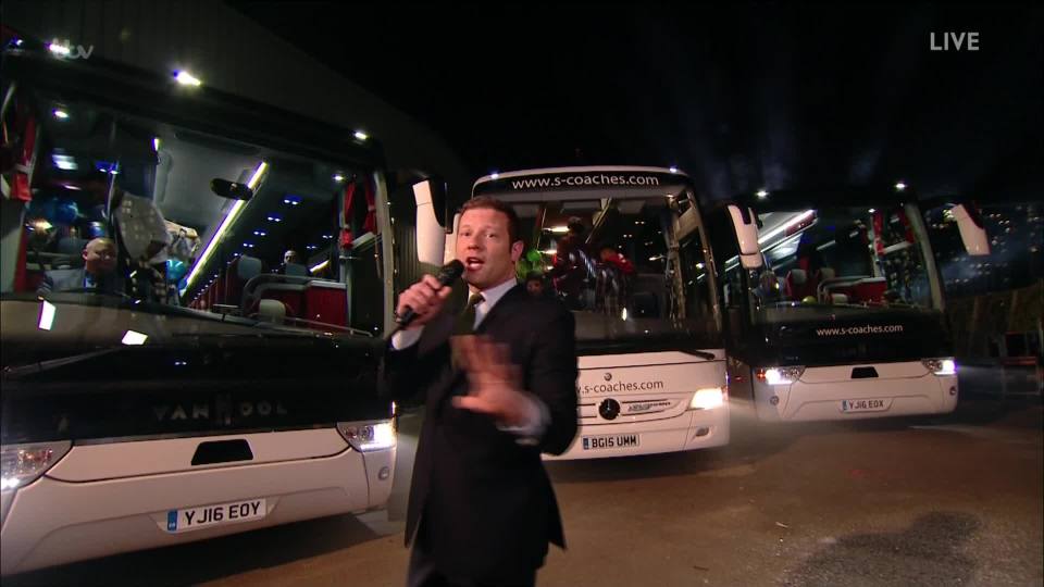 Host Dermot O'Leary with the X Factor 'battle buses'