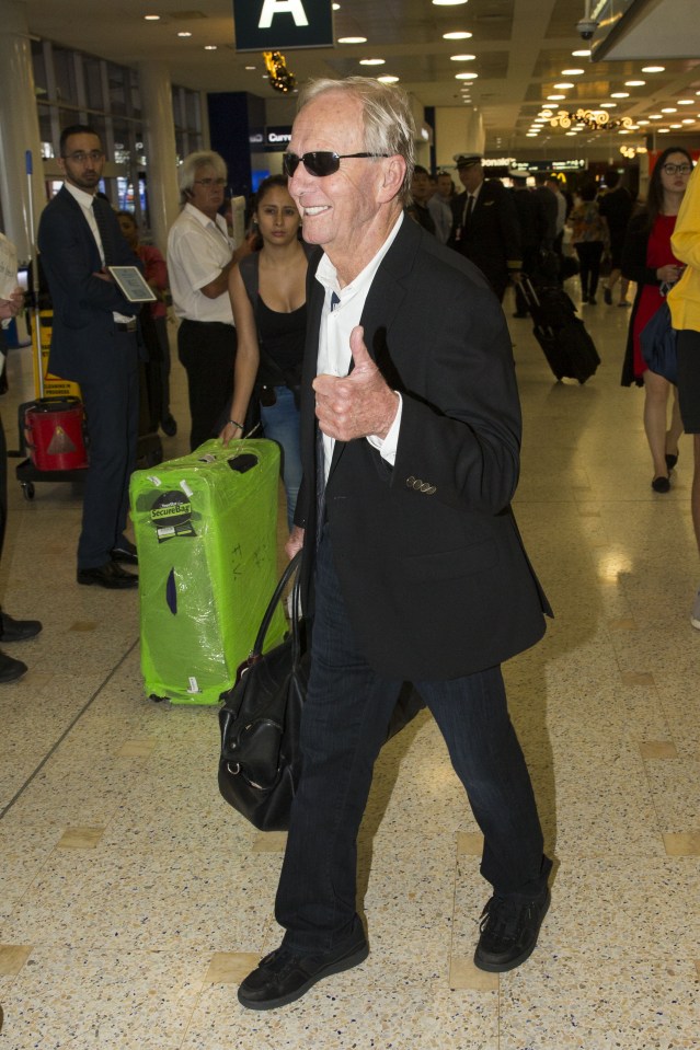 Paul gave a thumbs-up to fans and photographers as he landed back in his home country 