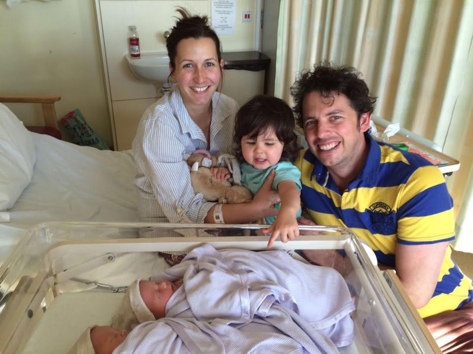 James Holgate and his wife Rachel pose for a photo with daughter Nora and their twin girls Nancy and Rita 