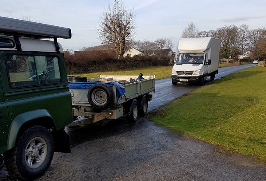 The delivery van pictured behind Dean Smith's trailer during the stand off after businessman Dean ordered a mattress from Amazon 