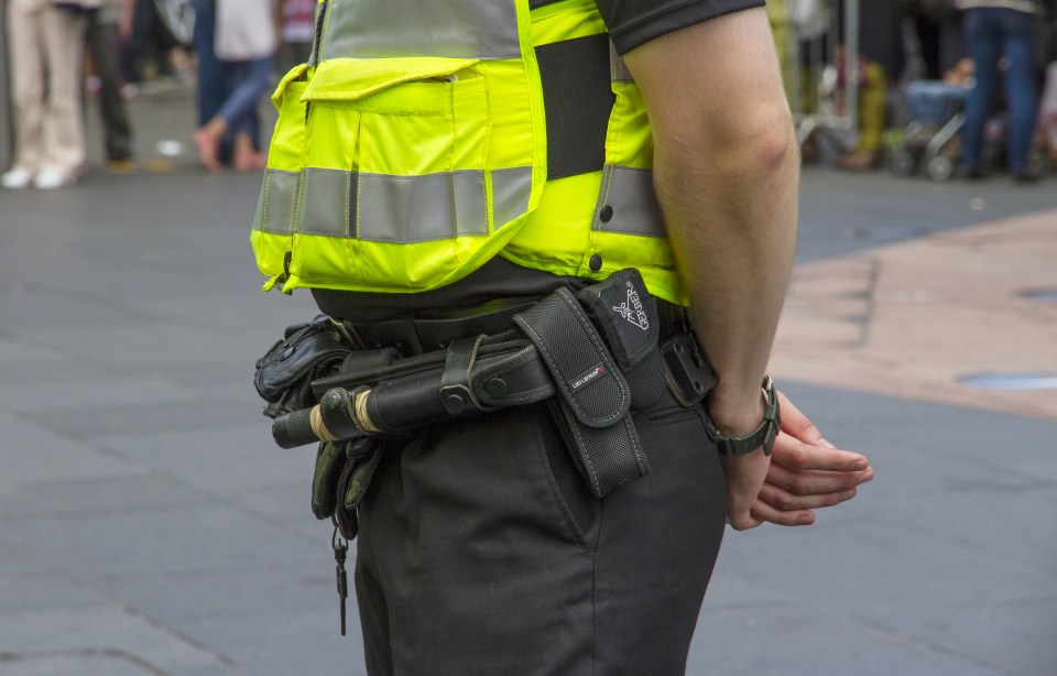 Close Up of Police Officer Detailing the Equipment They Carry