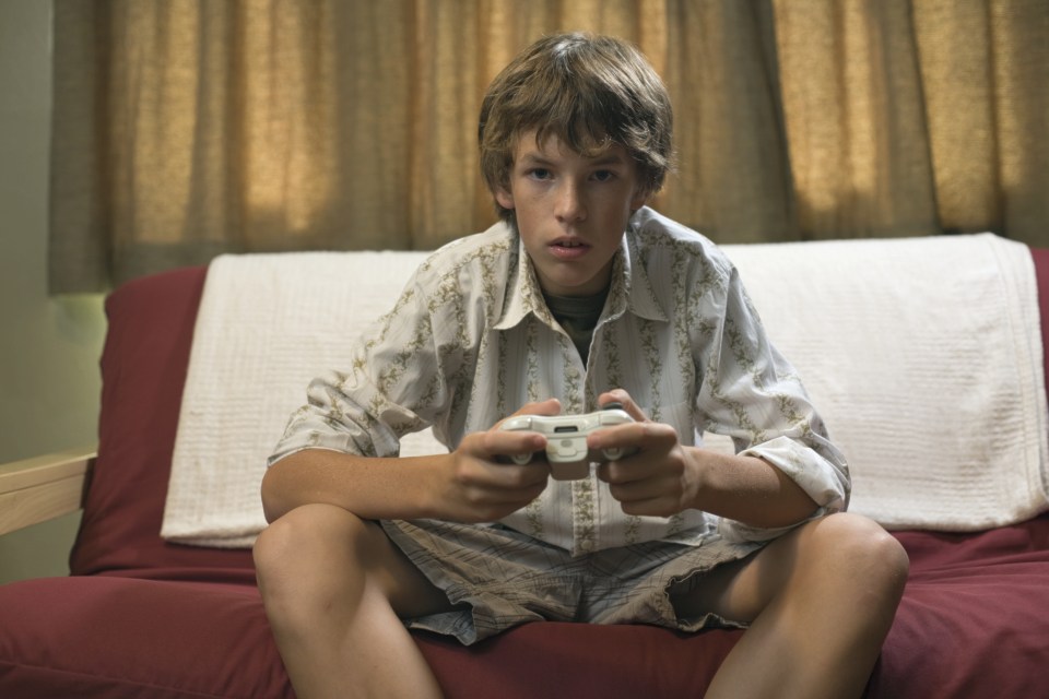 Teenage Boy Playing Video Game