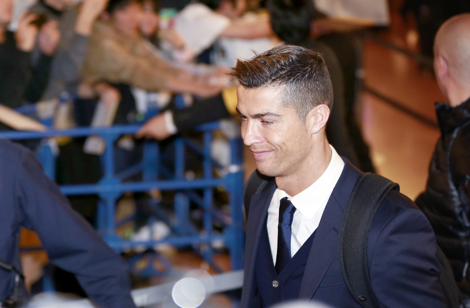 Cristiano Ronaldo arrives at Tokyo airport in good spirits