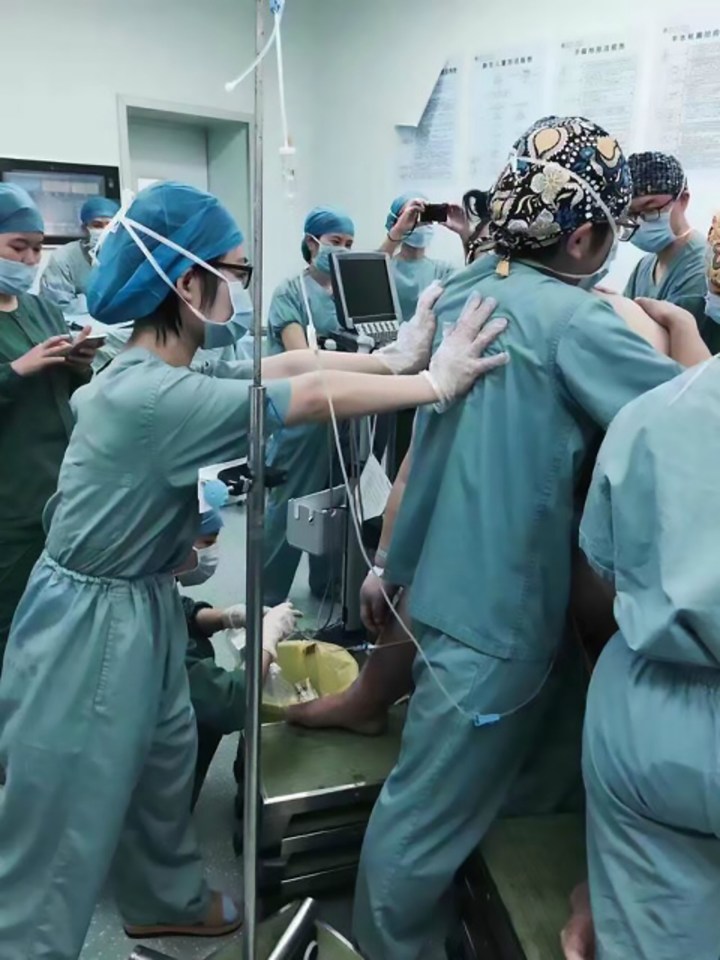 The medics were needed to help stabilise the mum. who was preparing to give birth to her second child at a hospital in central China