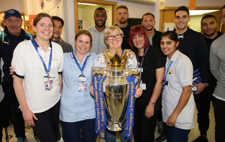  The staff managed to get a snap with the Premier League trophy and the players