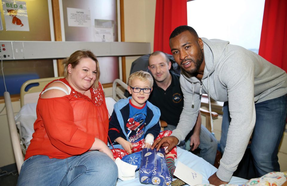  Skipper Wes Morgan takes time out to have a picture with a young boy and his parents