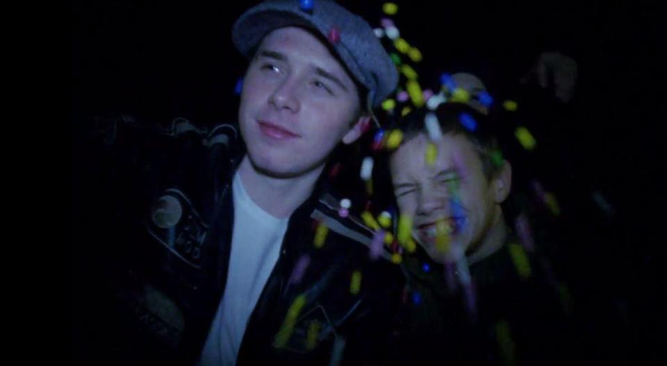  The pair have a giggle as they support their brother