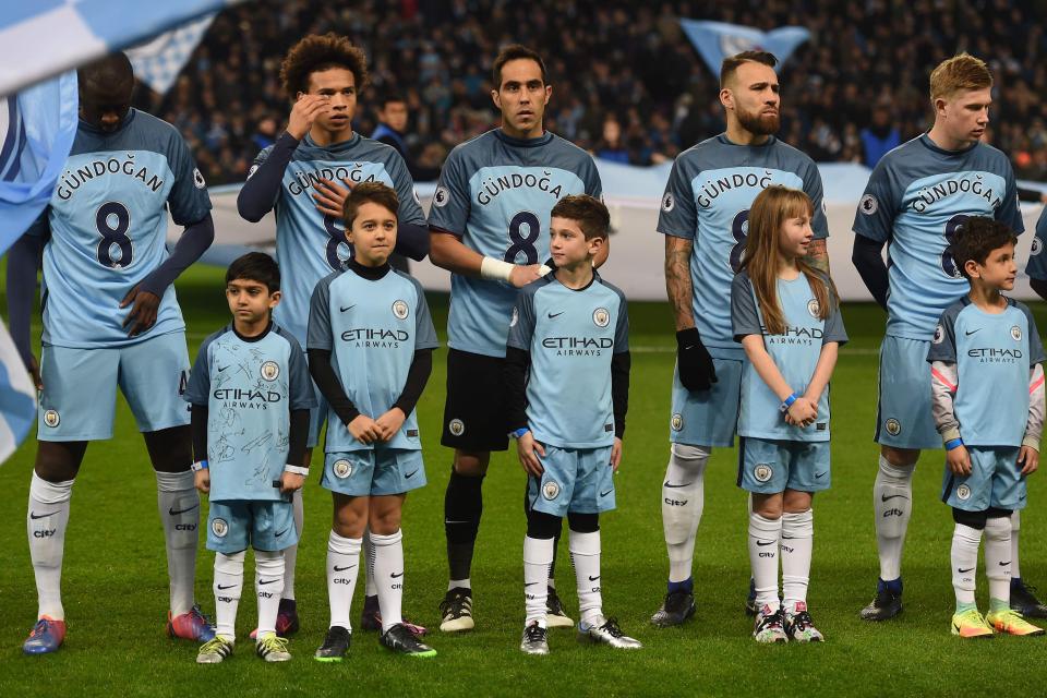  Manchester City's players lined up for a tribute to Ilkay Gundogan before their match against Arsenal