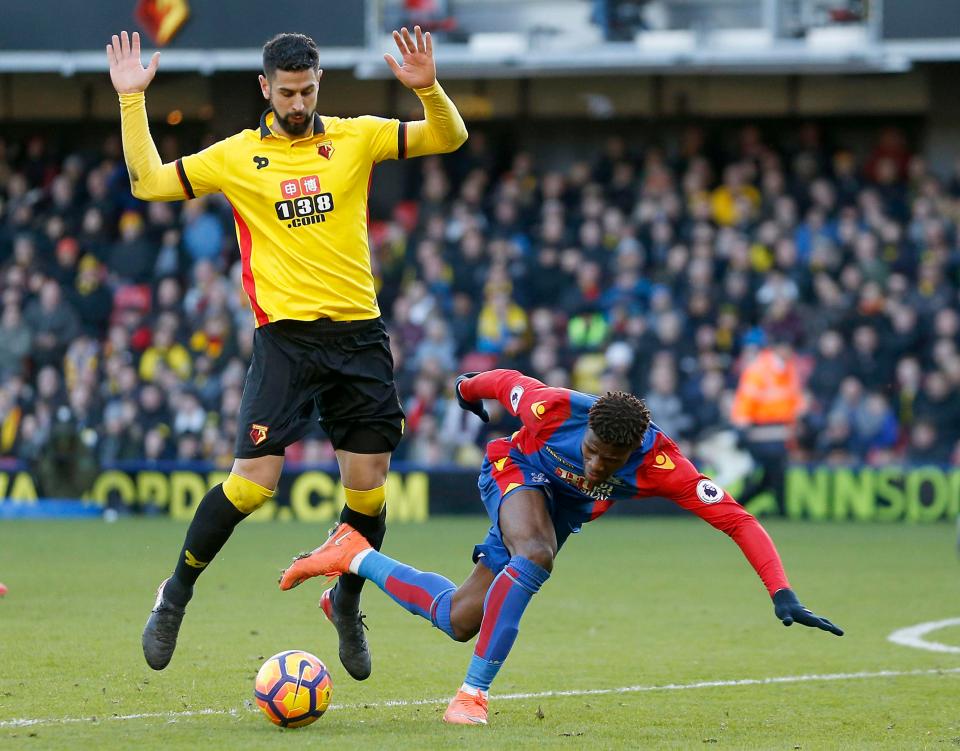 Wilfried Zaha was booked for diving after going down under this challenge from Miguel Angel Britos