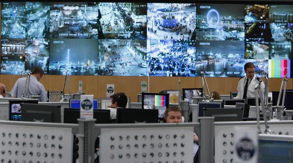 A bank of television monitors displays images captured by a fraction of London's CCTV camera network within the Metropolitan Police's Special Operations Room