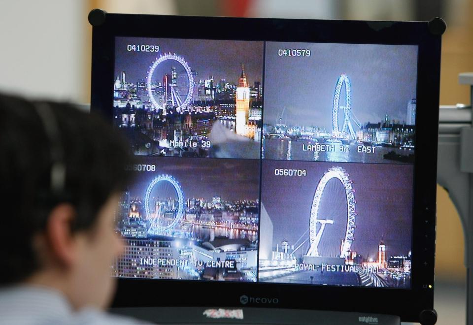 A police officer watches CCTV cameras during a previous New Year's Eve event in the capital as officers crackdown on crime