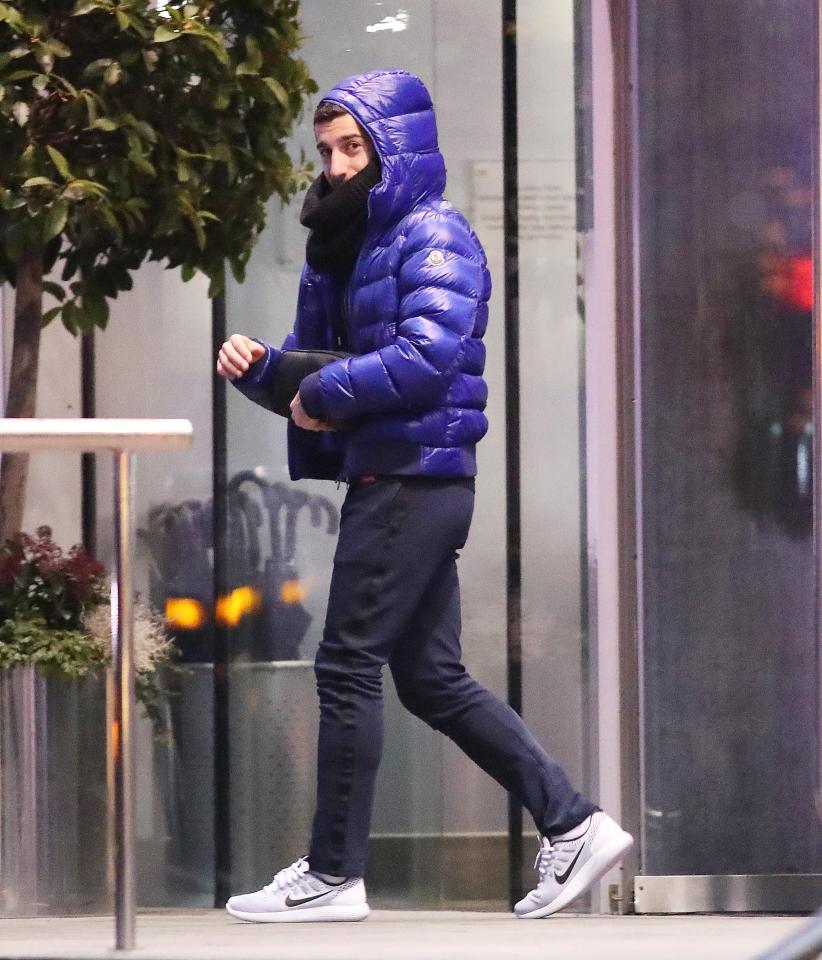 Wrapped up warm... Henrikh Mkhitaryan leaves for the training ground 10 minutes before the boss
