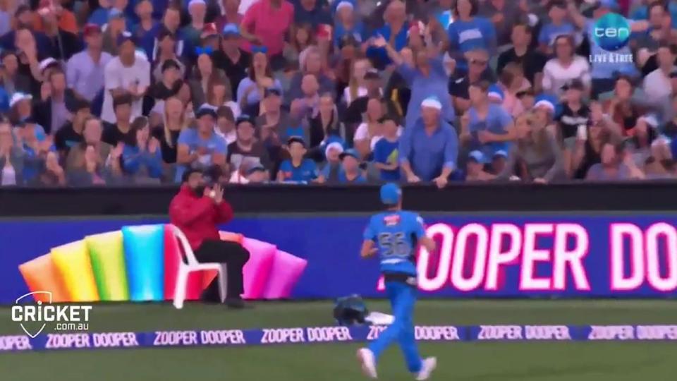 Security man takes a stunning, seated catch much to the crowd's delight