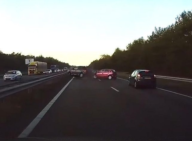  Microseconds after the alarm beeps the hatchback in front collides with a 4x4