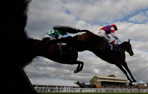 Sam Twiston-Davies riding Belmount (R) on their way to winning The bet365.com Silver Salver Handicap Steeple Chase at Hereford racecourse