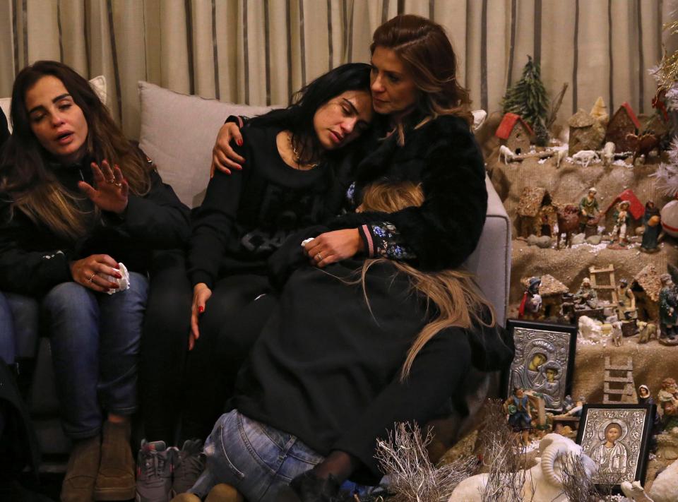 Sisters of Elias Wardini, a Lebanese man who was killed in the attack, comfort each other at their Beirut home 