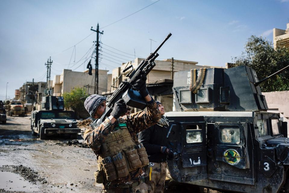 Iraqi government troops battle an ISIS drone in the sky