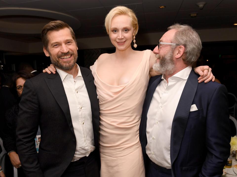  Gwnedoline Christie hugs co-stars Nikolaj Coster-Waldau and Liam Cunningham