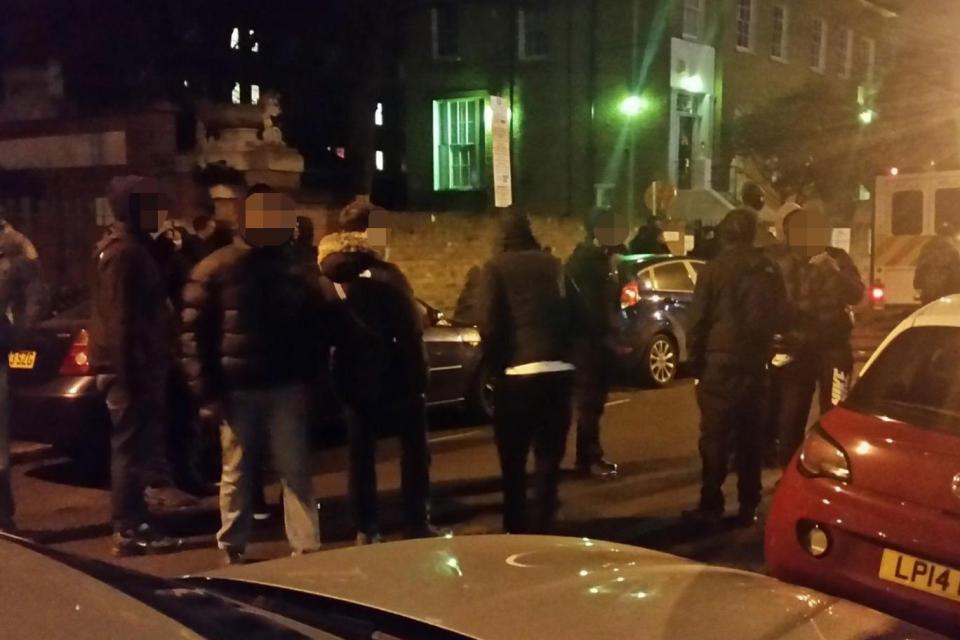 The gang were pictured outside the plush apartment after cops were called