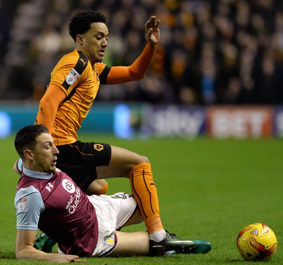 Helder Costa challenges Tommy Elphick