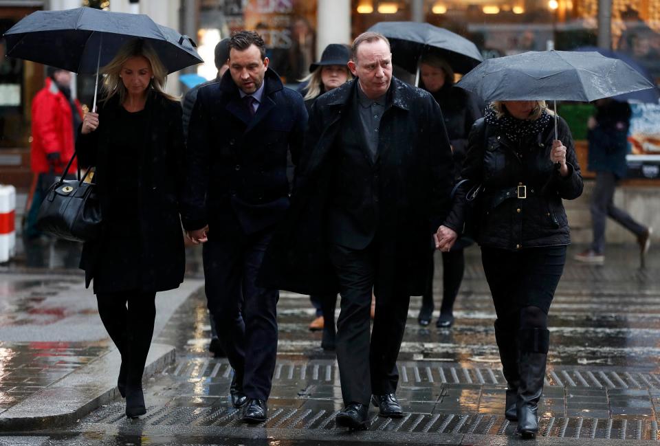 Mark Stocker, second from right, arrives for the start of the inquest into near Sousse in Tunisia, and the High Court in central London