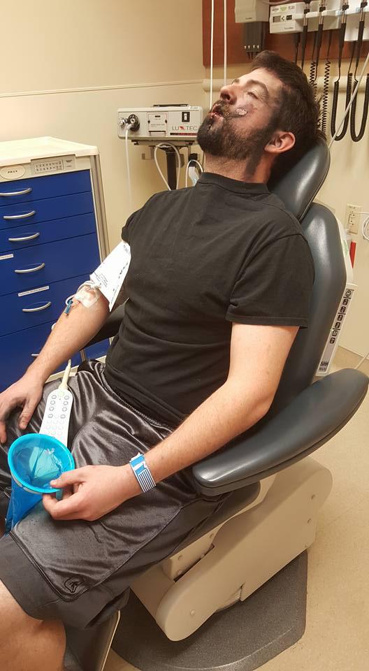 Andrew suffering in a dental chair as a dental surgeon sees what can be done for him 